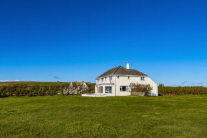 Side view of Booby's Bay Cottage from large grassed garden