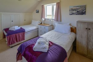 Twin single bedroom at Booby's Bay Cottage