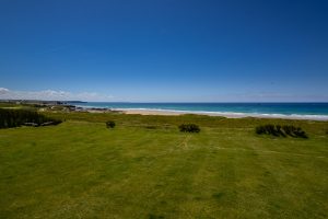 Large grassed garden at Booby's Bay Cottage