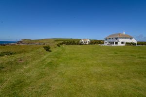 Rear exterior view of Booby's Bay Cottage from large grassed garden