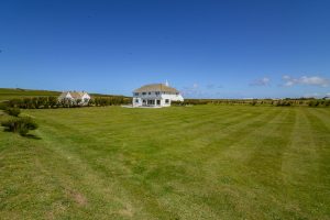 View of the rear exterior of Booby's Bay Cottage from large garden