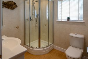 Walk in shower in ground floor bathroom at Beachcombers
