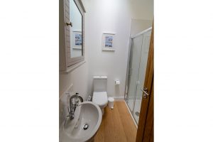 Walk in shower, sink and loo in bathroom 3 at Beachcombers