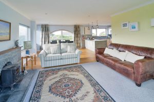 Open plan kitchen, dining area and lounge at Bosporthennis