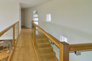 First floor hallway at Cheyney with glass balustrades