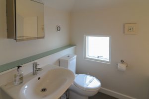 Toilet and basin in bathroom at Cheyney