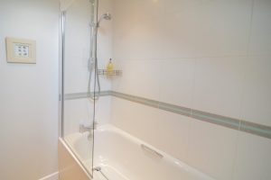 Bath with overhead shower at Cheyney