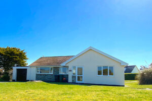 Front exterior view of Cobs with large grassed front garden