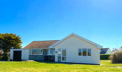 Front exterior view of Cobs with large grassed front garden