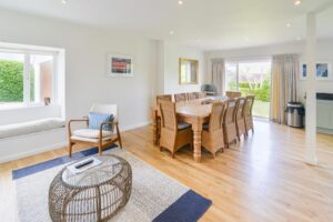 Dining area at Curlews with double doors leading to the back garden
