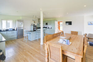 Open plan dining and kitchen area at Curlews