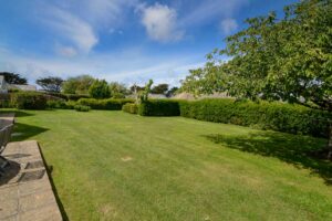 Large grassed garden area at the back of Curlews