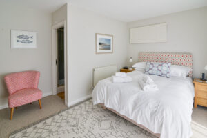 Ground floor king bedroom with door leading to ensuite