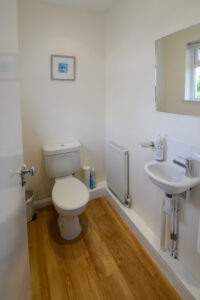 Bathroom with loo and basin at Curlews