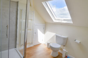 First floor bathroom with walk in shower at Curlews