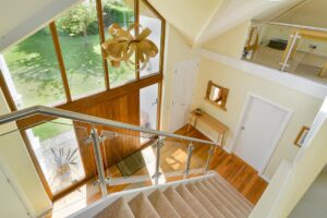 Staircase leading from first floor to front entrance hall at Curlews
