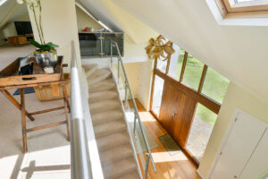 Birdseye view from first floor down to front entrance at Curlews