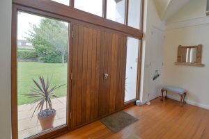 Front entrance hall way at Curlews with large front door