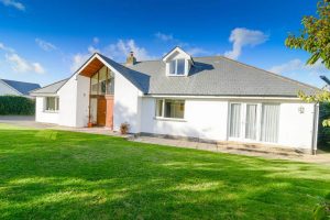 Exterior view from front grassed garden at Curlews