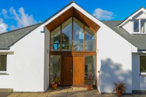Exterior front entrance with large glass windows at Curlews