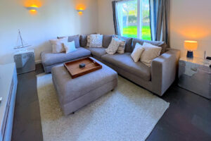 Corner sofa in lounge at Cheyney