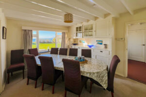 Dining room at Booby's Bay Cottage with sea views
