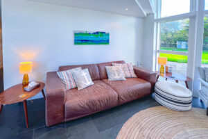 Sofa in corner in lounge at Cheyney