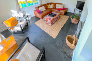 Lounge with log burner, TV and seating at Cheyney