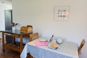 Seating area in kitchen and fridge and Aquataine Annexe