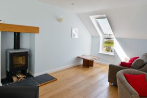 Log Burner and seating area on first floor at Aquataine Annexe