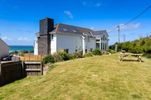 Exterior view of back of Aquataine Lodge from grassed garden area