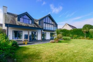 Rear exterior at Blue Seas, large grassed garden
