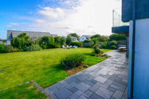 Large grassed garden area from patio at Blue Seas