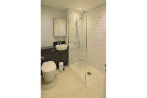 Ensuite bathroom from Bedroom 4 with walk in shower on ground floor at Blue Seas