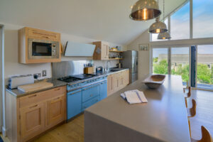Well equipped kitchen at Blue Seas with large island and seating