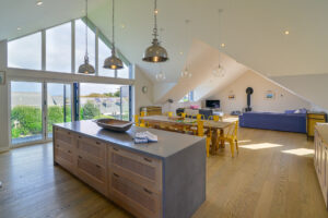 Open plan kitchen, dining area and lounge at Blue Seas
