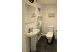 Singular toilet room on ground floor at Blue Seas