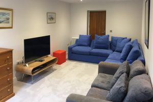 Kids room with pull out sofa, ample seating at TV at Blue Seas