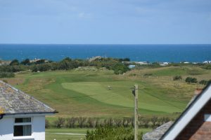 View of Trevose golf course and the sea from window at Blue seas