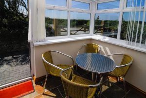 Seating in Conservatory room at Carnavis Cottage