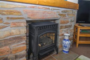 Gas fired wood burner at Carnavis Cottage