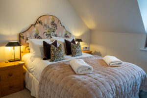 King bed in master ensuite bedroom at Penjerrick
