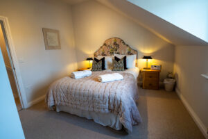 Master ensuite bedroom at Penjerrick with king bed