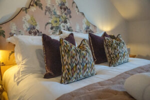 Cushions on king bed in master ensuite bedroom at Penjerrick