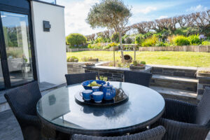Outdoor seating area on the patio in the back garden at Morvoren