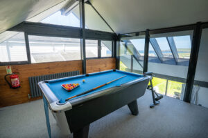 Games room on the first floor at Morvoren with pool table and sea views
