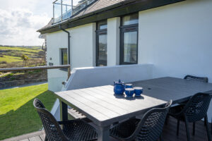 Dining table on decking at Morvoren