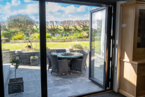 Patio area with seating from the kitchen bi folds at Morvoren