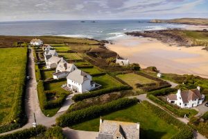 Aerial view of South Corner the beach and adjacent properties