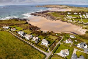 Aerial view over Treyarnon Bay towards Constantine Bay and Trevose Head